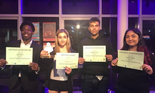 Four students showing their Certificate of participation